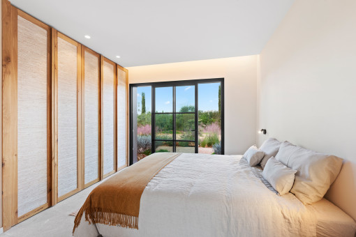 One of the three lower-level bedrooms with garden access