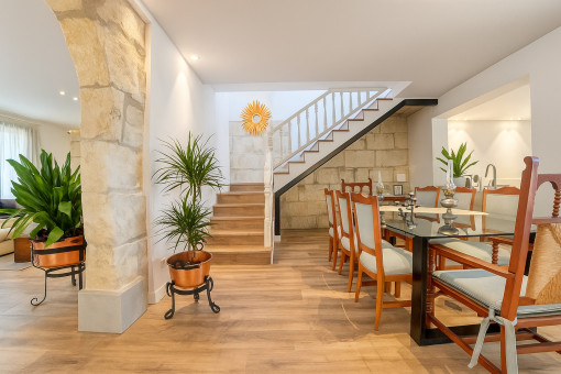 Dining area with staircase to the upper floor and open layout