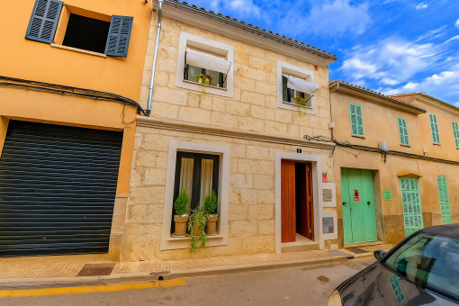 Street view of the renovated sandstone façade in Santa Margalida