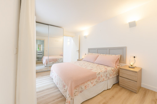 Third double bedroom with built-in wardrobe and bright accents