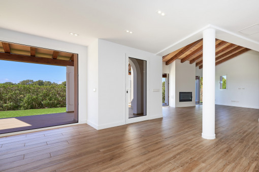 Living area with beautiful wooden beams and access to the garden