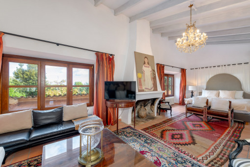 Master suite with living area and views of the terraces