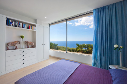 One of the three bedrooms with sea views
