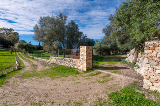Finca entrance with natural stone walls