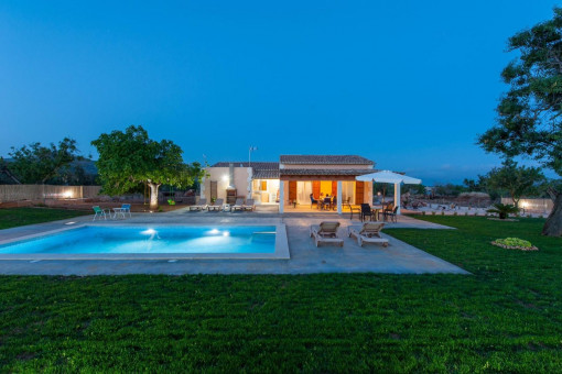 Exterior view with pool at night