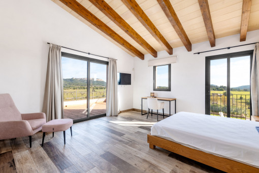 One of the three bedrooms on the upper floor with private terrace...