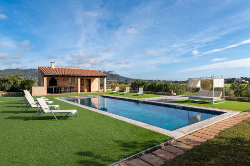 Open views and covered barbecue area by the pool