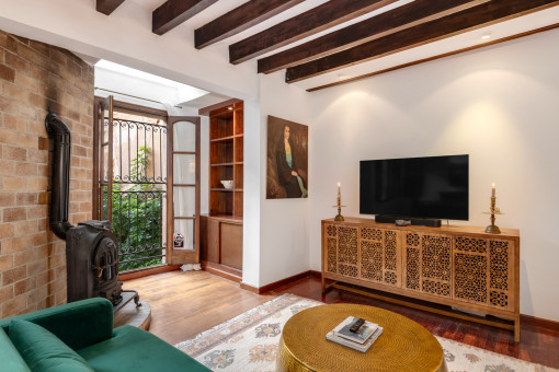 Spacious living area with views of the green patio