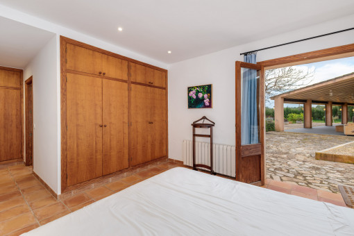 One of the four bedrooms with access to the garden