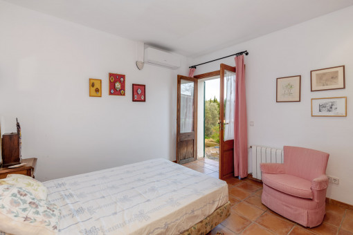 One of the four bedrooms with access to the garden