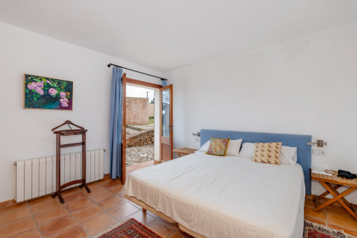 One of the four bedrooms with access to the garden