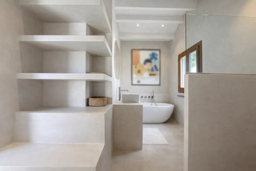 Bathroom with bathtub and shelving