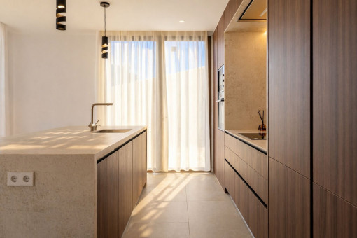Kitchen with island and access to the pool terrace