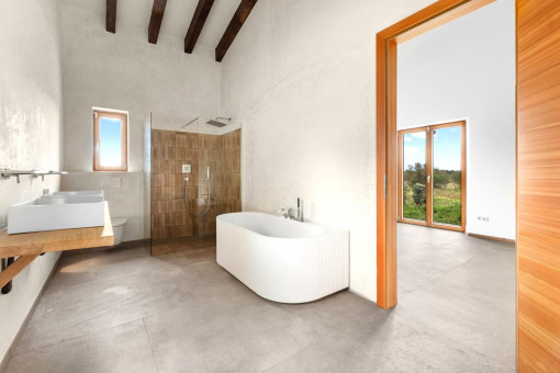 Master bathroom with bathtub and shower