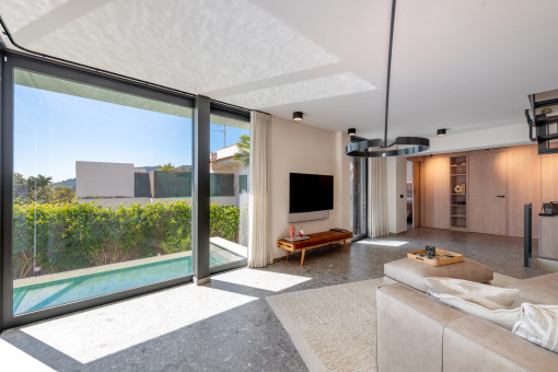 Light-filled living area with large window fronts