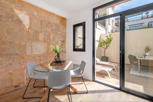 Dining Area With Marès Stone Wall
