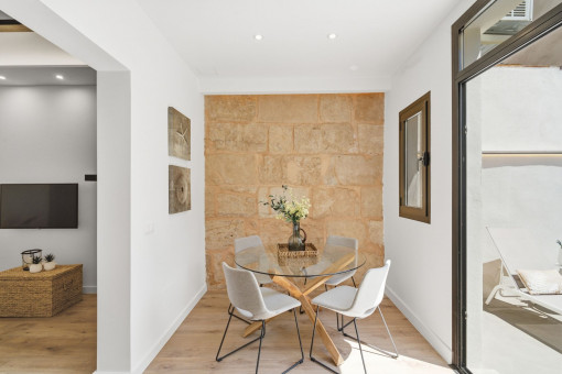 Dining area with Marès stone wall 