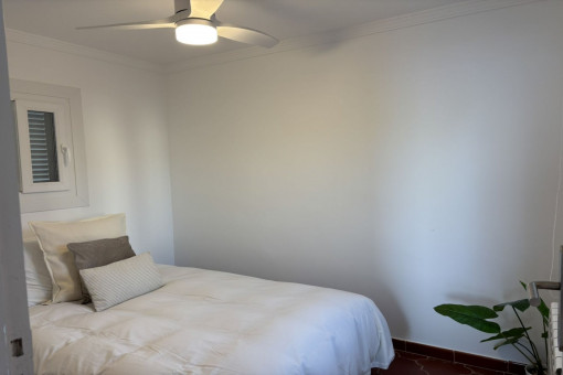 Cozy bedroom with fan