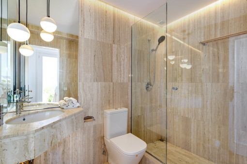 Bathroom with shower and natural stone