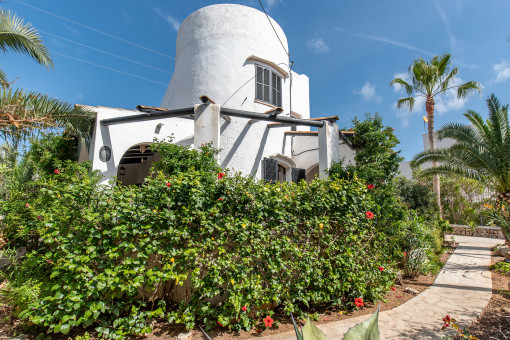 The garden and terraces extend all around the house