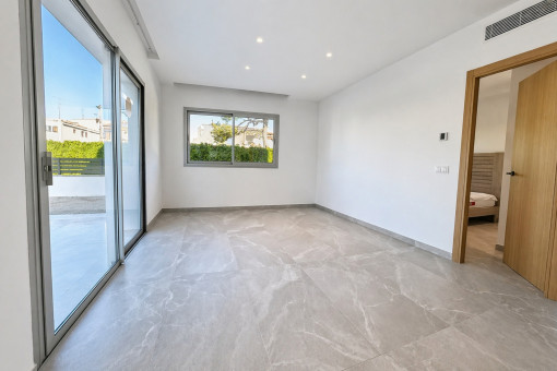 Living and dining area with access to the terrace