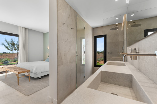 Natural stone en-suite bathroom with shower