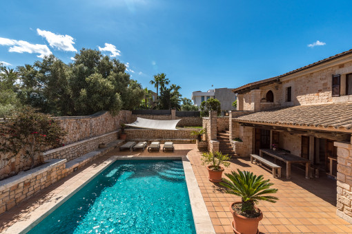 The terrace and pool are situated on a slightly lower level