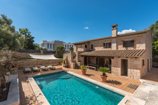 The terrace and pool are situated on a slightly lower level
