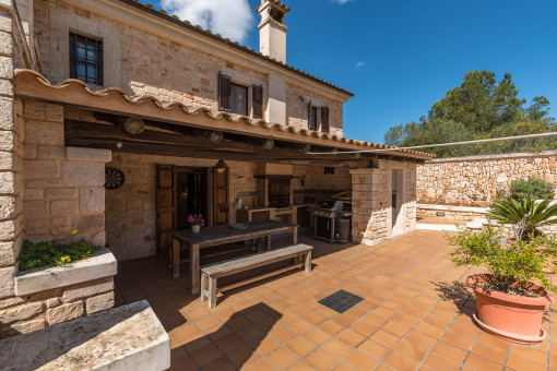 Covered terrace directly adjacent to the house with access to the ground floor