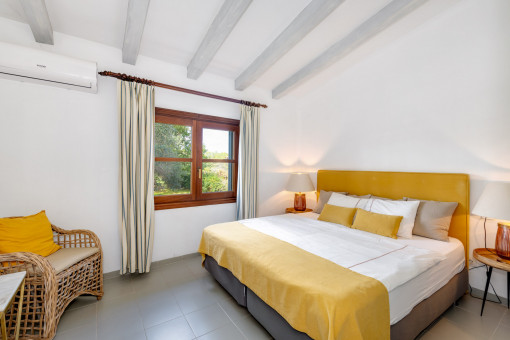 One of the three bedrooms in the south wing with access to the terrace