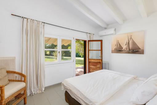 One of the three bedrooms in the south wing with access to the terrace