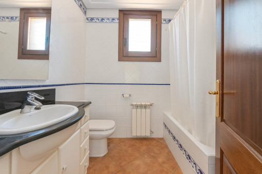 Bathroom with bathtub and sink