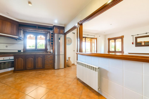 Traditional kitchen with open living area