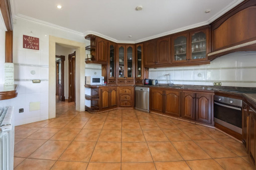 Spacious kitchen with wood cabinets