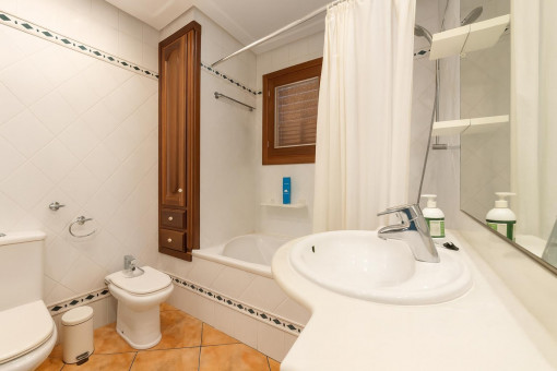 Bathroom with bathtub and bidet