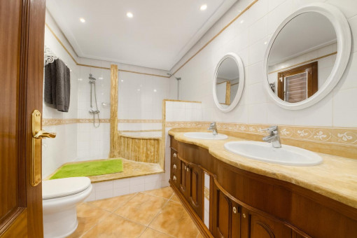 Bathroom with double sink and shower