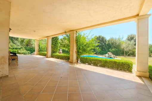 Covered terrace with pool and garden