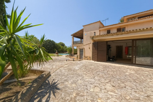 Spacious stone patio with pool view