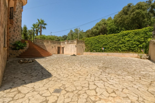 Spacious paved courtyard with garden