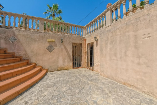 Courtyard with stone floor and stairs