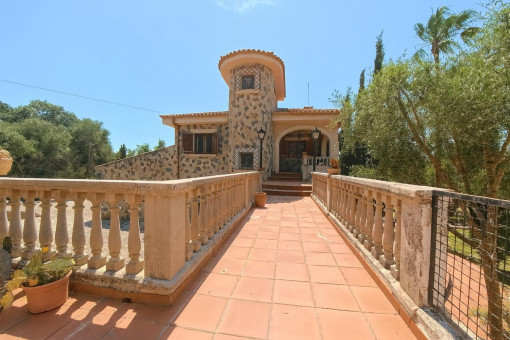 Stone house entry with balustrade