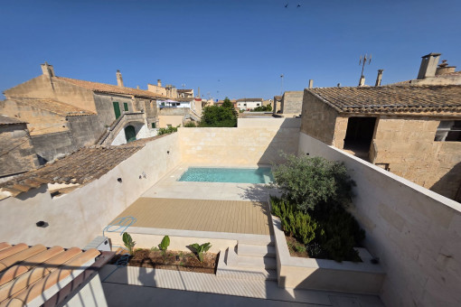 View from the balcony over the patio and pool area