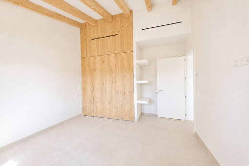 Bedroom with custom-built wardrobes