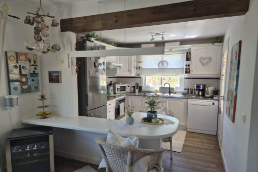 Open country-style kitchen with dining area