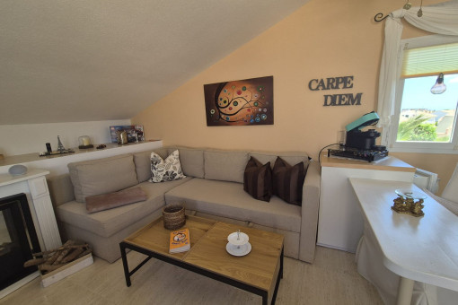 Upper living and dining area with fireplace