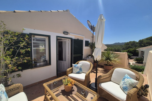 Sunny rooftop terrace with lounge area