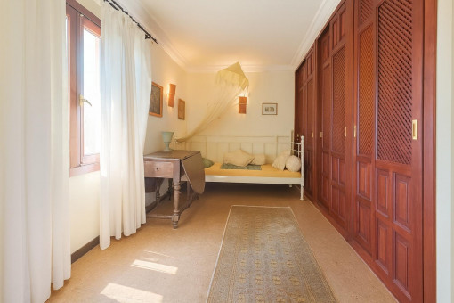 Bright bedroom with large wardrobe