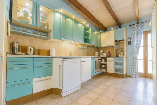 Bright kitchen with blue cabinets