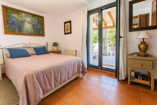 Cozy bedroom with balcony access