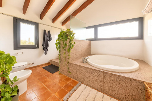 Bright bathroom with corner bathtub